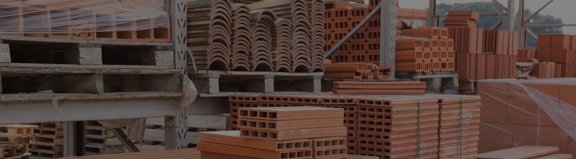Pallets of construction materials for a building installation project.
