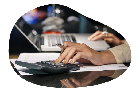 A small business owner calculating their liquor liability costs A small business owner calculating their liquor liability costs