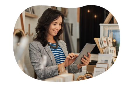 A small business owner reviewing their product liability policy on their tablet A small business owner reviewing their product liability policy on their tablet