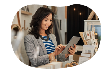 A small business owner reviewing their product liability policy on their tablet