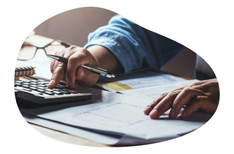 A small business owner calculating their product liability insurance costs A small business owner calculating their product liability insurance costs