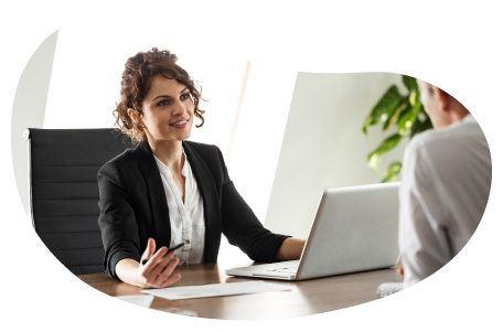 A small business owner discussing their professional liability coverage with a client A small business owner discussing their professional liability coverage with a client