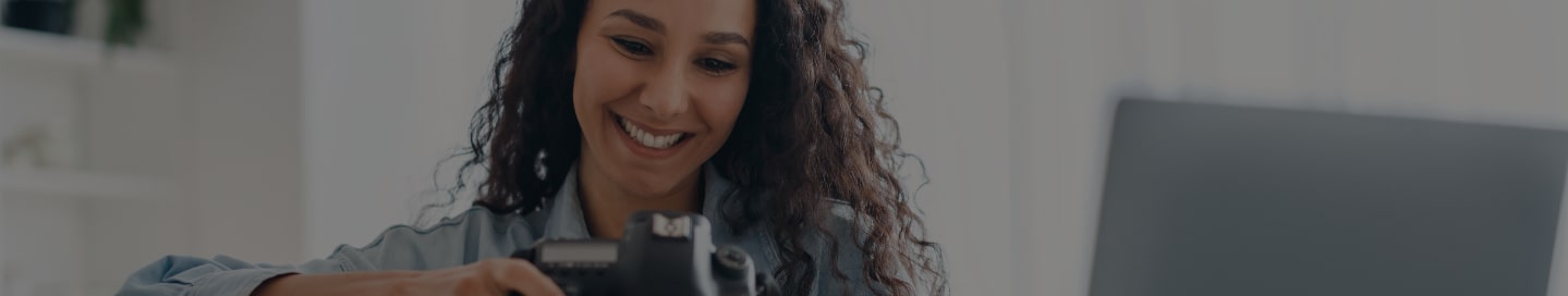 Freelancer reviewing client photos in their office.