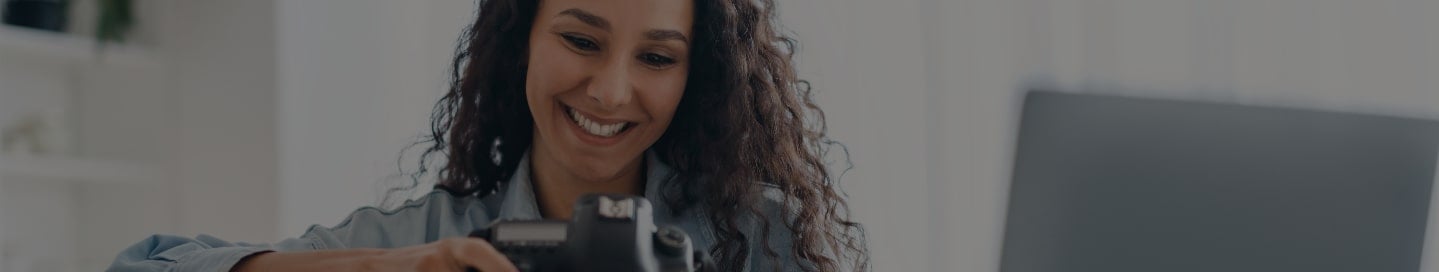Freelancer reviewing client photos in their office. Freelancer reviewing client photos in their office.