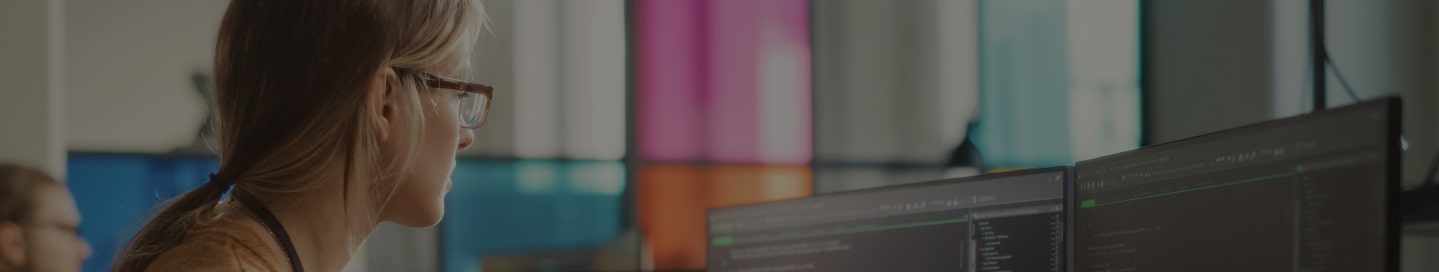 A programmer writing code inside a startup office.