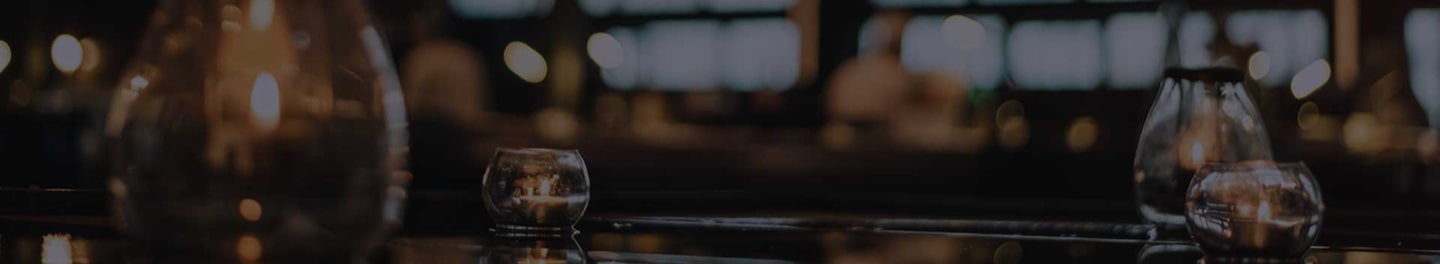 Table decorated with candles for an event.