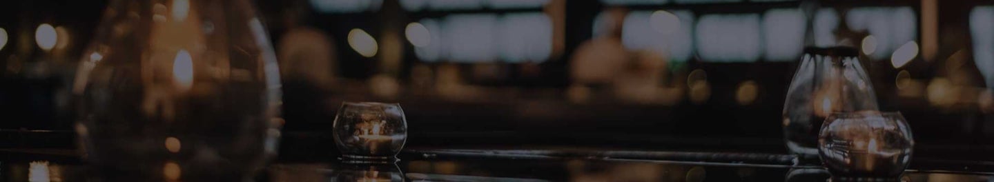 Table decorated with candles for an event. Table decorated with candles for an event.