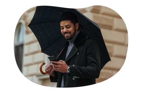 A small business owner reviewing their commercial umbrella policy on their cell phone A small business owner reviewing their commercial umbrella policy on their cell phone