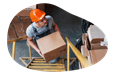 A worker putting away inventory in a warehouse