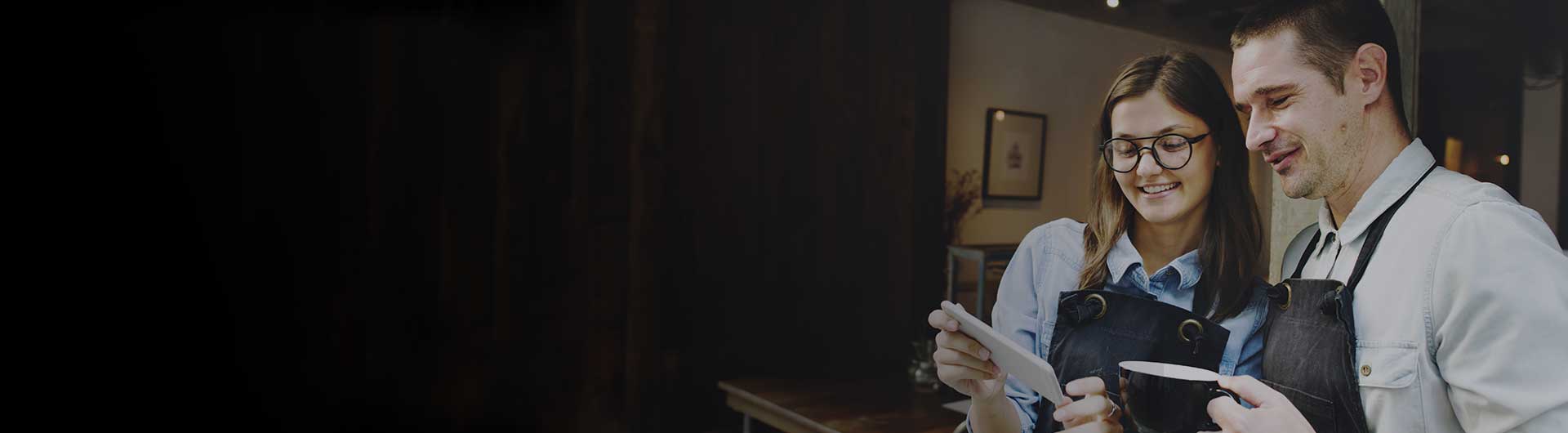 Two business owners looking at state requirements for insurance.