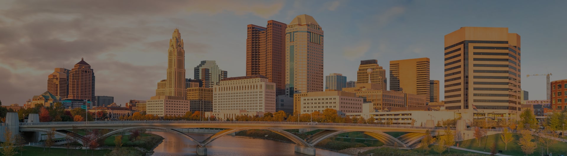 Columbus city skyline over river.