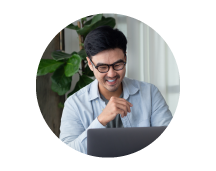 A small business owner chooses a policy on their laptop.