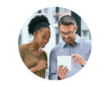 Small business owners fill out an insurance application.